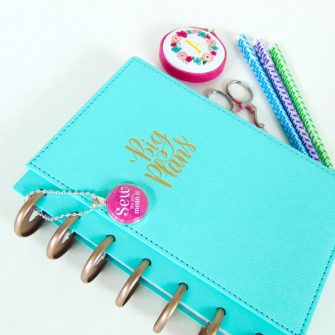 Fuchsia swing tag helps adorn this planner! Andrie Adornments