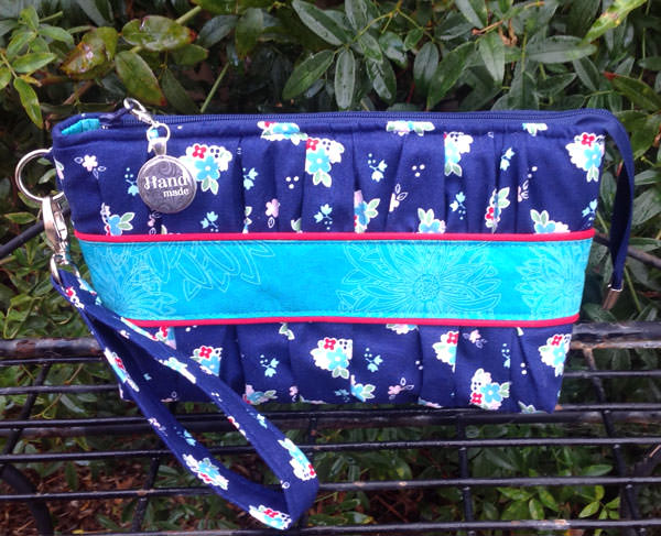 Blue floral with a pop of red Gather Me Up Clutch