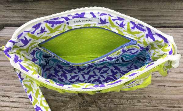 Inside the lime green Gather Me Up Clutch - Andrie Designs
