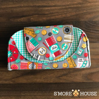 Front view of the sewing-themed Cleo Everyday Wallet - Andrie Designs